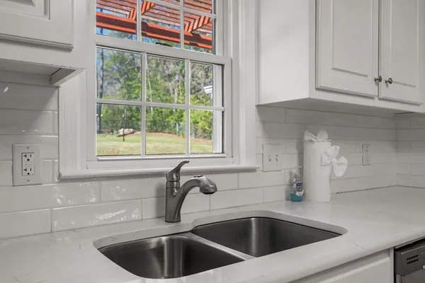 a kitchen with a sink and a window