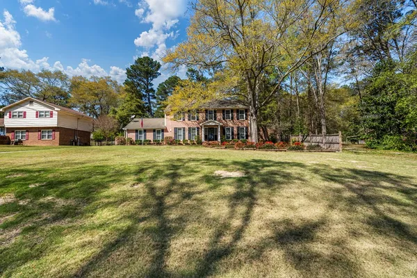 a view of a house with a big yard