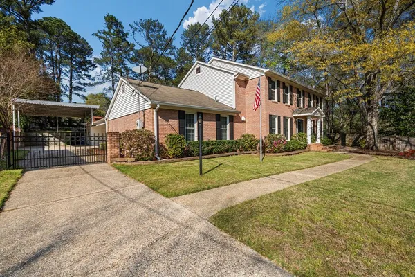 a view of house in front of house with yard
