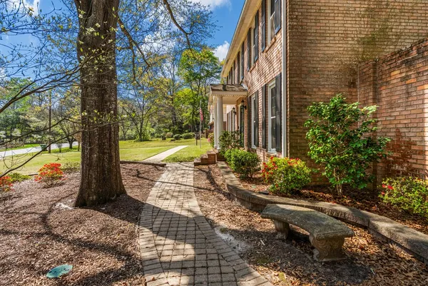 a view of a pathway with a yard