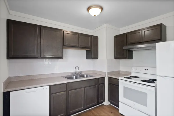 a kitchen with stainless steel appliances a sink stove and microwave