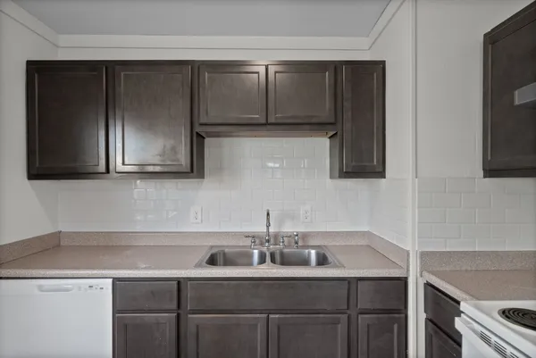 a kitchen with a sink and cabinets