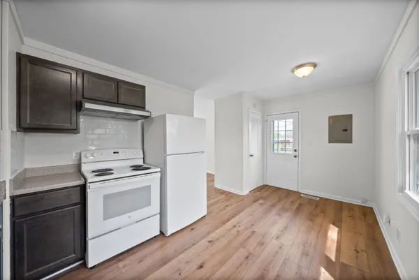 a kitchen with a stove oven and sink