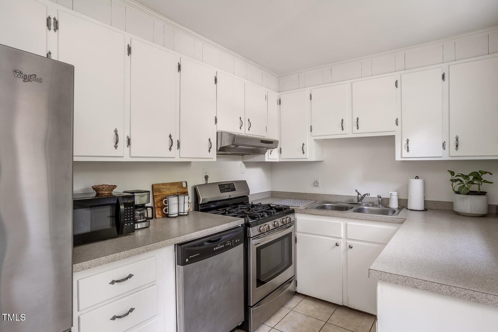 2331 Stevens Road Raleigh, NC 27610 - Photo 11 of 33 a kitchen with cabinets appliances a sink and a counter top