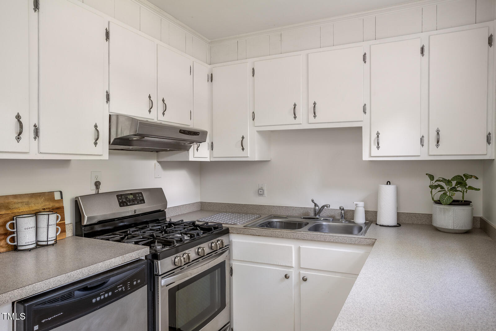 2331 Stevens Road Raleigh, NC 27610 - Photo 12 of 33 a kitchen with stainless steel appliances granite countertop a sink a stove and cabinets