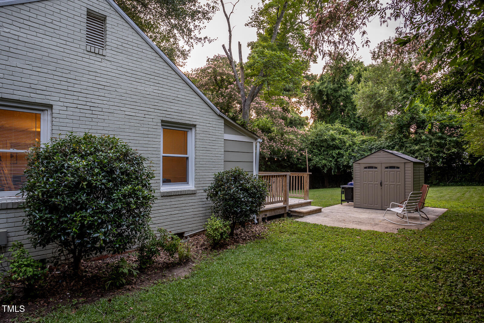 2331 Stevens Road Raleigh, NC 27610 - Photo 24 of 33 a front view of a house with a garden and trees