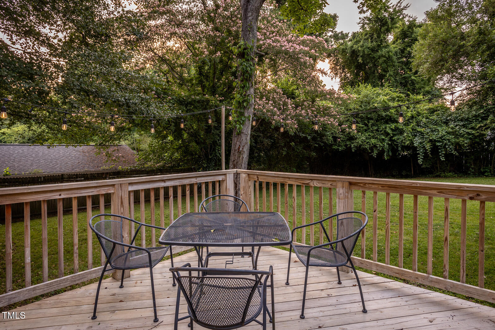 2331 Stevens Road Raleigh, NC 27610 - Photo 27 of 33 a view of balcony with table and chairs and wooden floor
