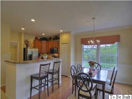 5585 Summerdean Road Crozet, VA 22932 - Photo 7 of 16 a dining area with a table chairs and a kitchen view