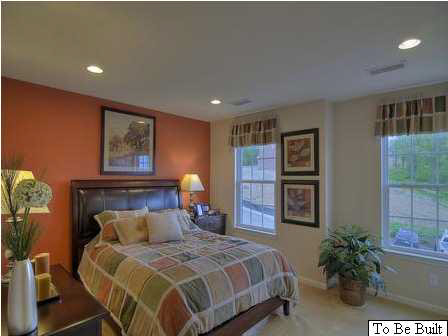 5585 Summerdean Road Crozet, VA 22932 - Photo 10 of 16 a bedroom with a bed and a potted plant