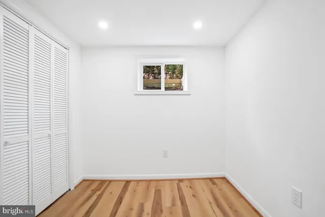 a bathroom with a shower sink vanity mirror and toilet