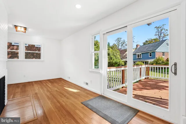 a view of a kitchen with wooden floor and a kitchen