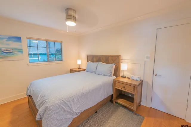 a bedroom with a bed and a window