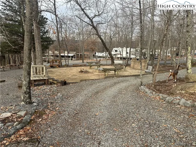 a front view of a house with a yard table and chairs