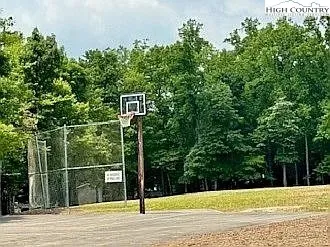 a backyard of a house with yard table and chairs