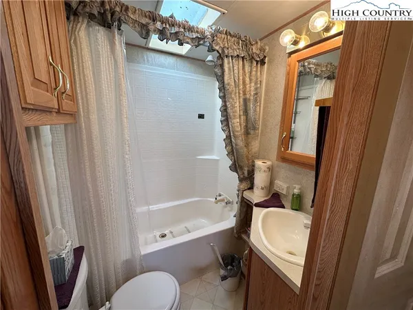 a bathroom with a tub and a shower