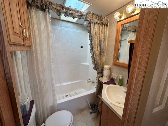 a bathroom with a tub and a shower
