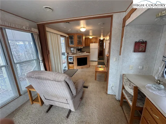 a bedroom with a bed and a mirror