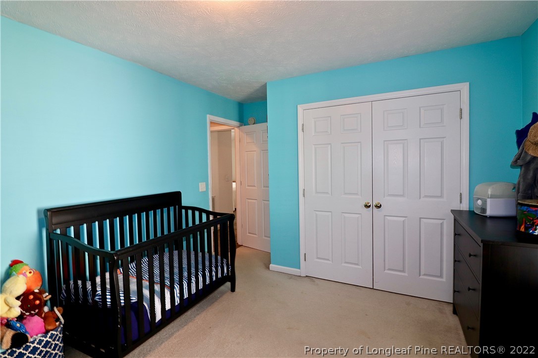 25 Fox Run Road Pinehurst, NC 28374 - Photo 22 of 28 a view of hallway with a window and stairs