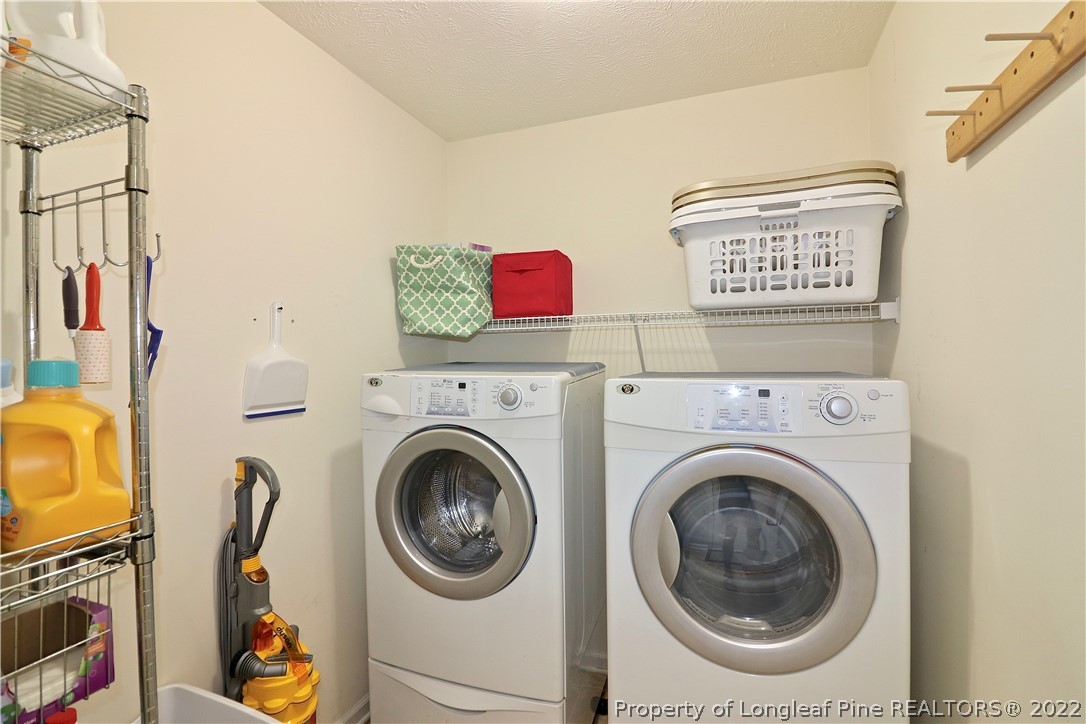 25 Fox Run Road Pinehurst, NC 28374 - Photo 23 of 28 a utility room with dryer and washer