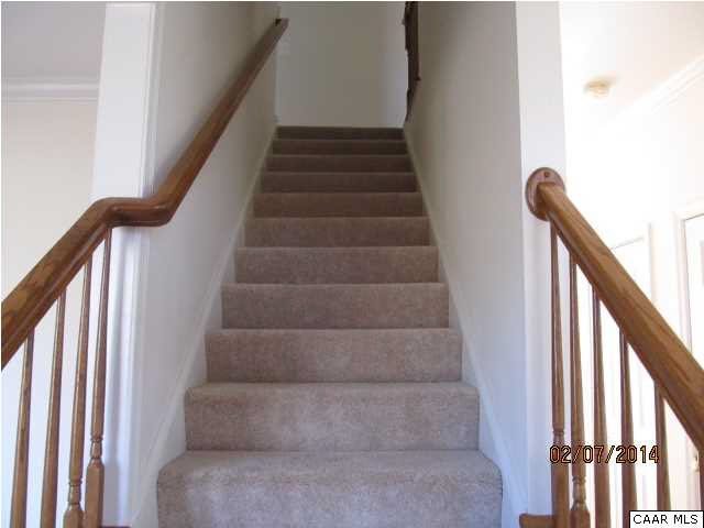655 Reedy Creek Road Louisa, VA 23093 - Photo 6 of 10 a view of staircase with wooden floor and white walls