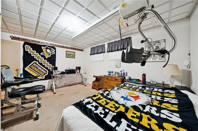 a bedroom with bed and musical instruments