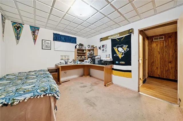 a bedroom with furniture and window