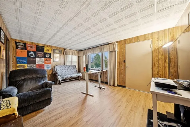 a bedroom with furniture and a window