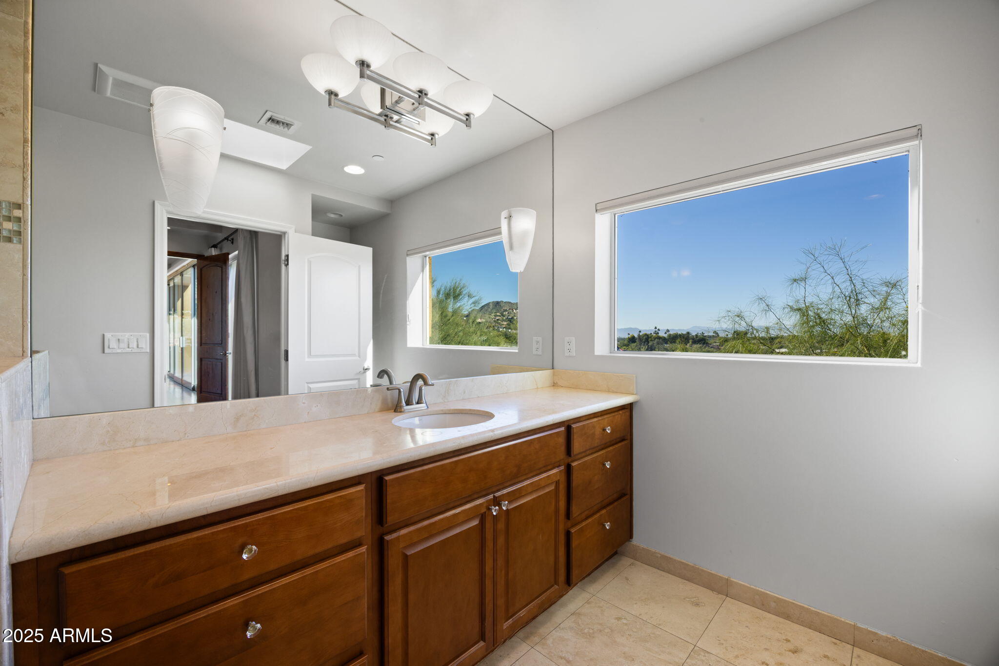 4820 East Cottontail Run Road Paradise Valley, AZ 85253 - Photo 14 of 22 a bathroom with a sink double vanity and a mirror