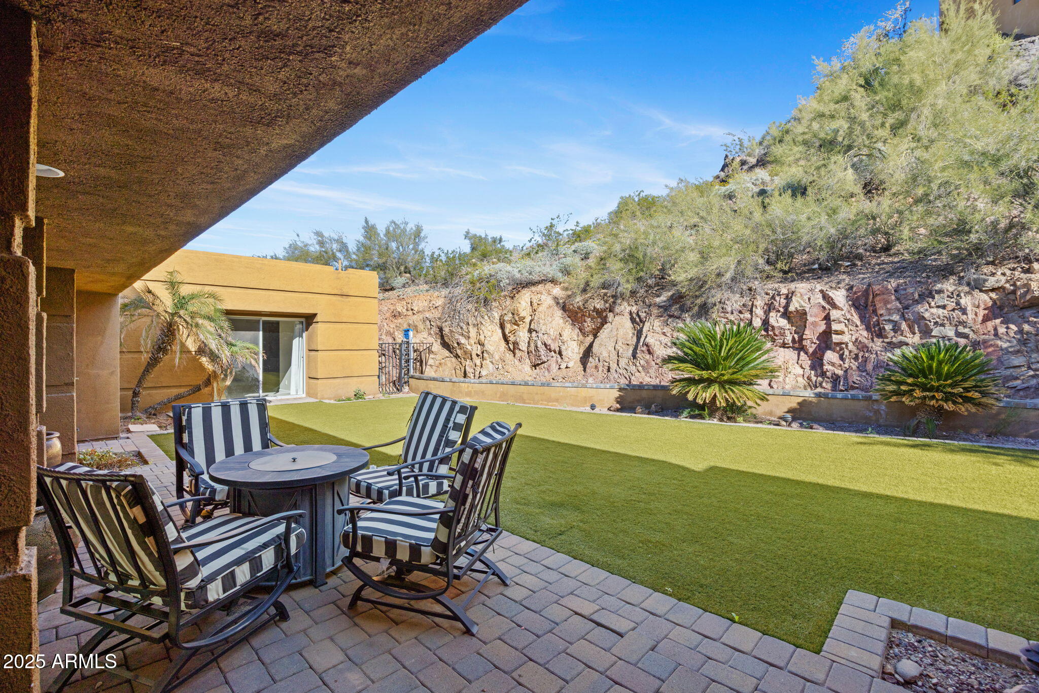 4820 East Cottontail Run Road Paradise Valley, AZ 85253 - Photo 7 of 22 a view of a chairs and table in the patio