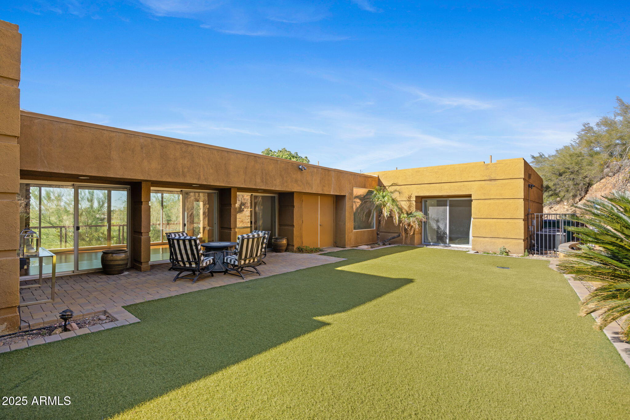 4820 East Cottontail Run Road Paradise Valley, AZ 85253 - Photo 8 of 22 a view of a house with backyard sitting area and garden