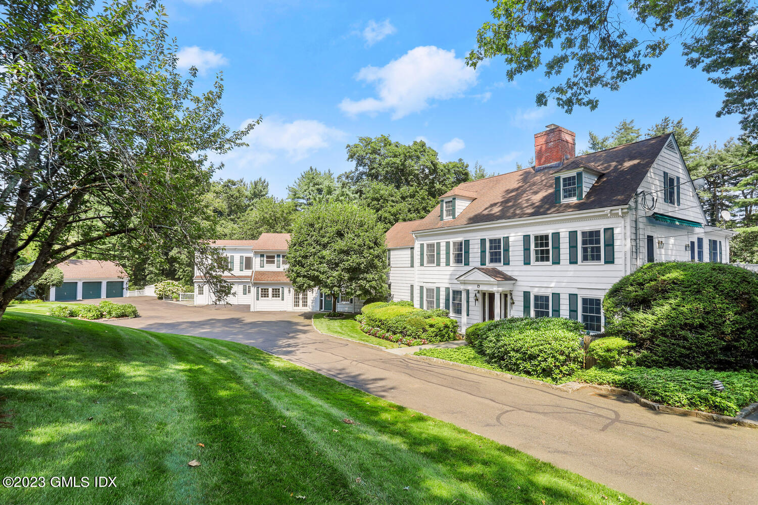 23 Bobolink Lane Greenwich, CT 06830 - Photo 1 of 28 a front view of a house with a garden
