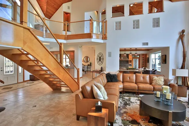 a view of swimming pool with a lounge chairs