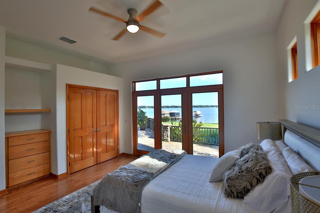11035 Southeast Sunset Harbor Road Summerfield, FL 34491 - Photo 24 of 97 a bed sitting in a bedroom next to a window