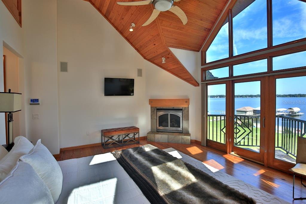 11035 Southeast Sunset Harbor Road Summerfield, FL 34491 - Photo 31 of 97 a living room with furniture fireplace and flat screen tv