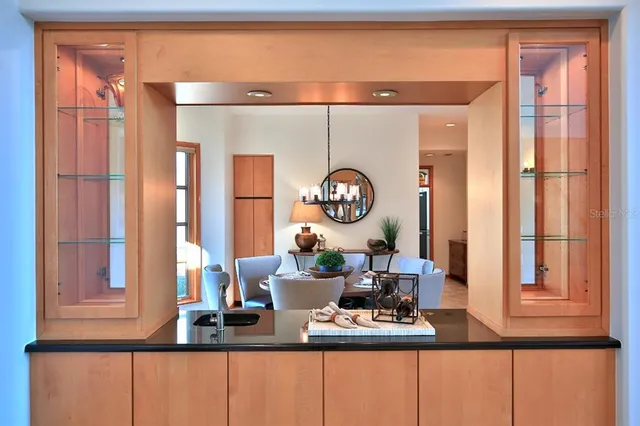 a dining room with furniture and wooden floor