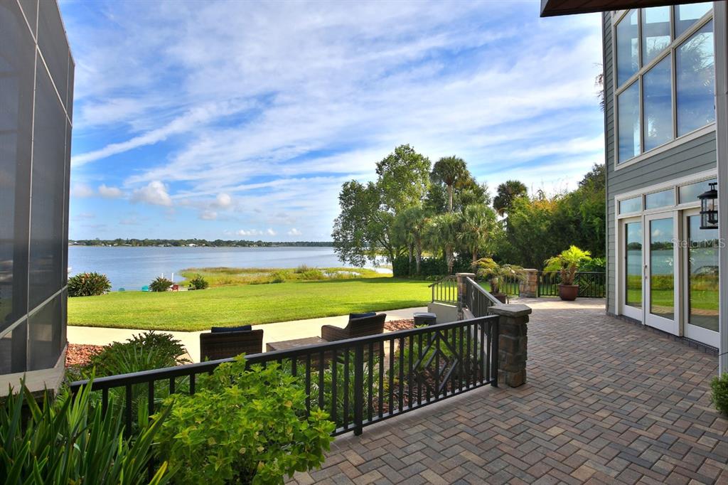 11035 Southeast Sunset Harbor Road Summerfield, FL 34491 - Photo 65 of 97 a view of a swimming pool with a patio and a yard