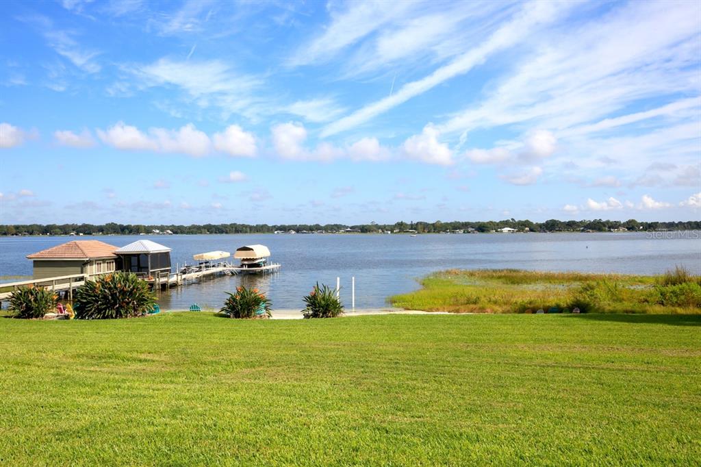 11035 Southeast Sunset Harbor Road Summerfield, FL 34491 - Photo 66 of 97 a view of a lake with houses