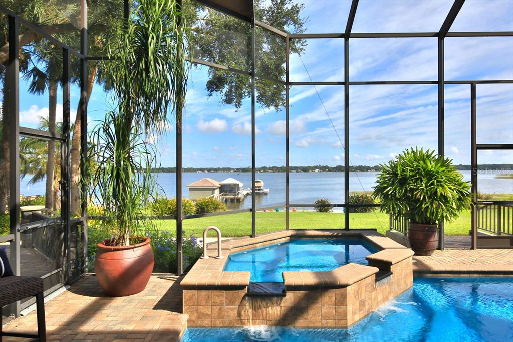 11035 Southeast Sunset Harbor Road Summerfield, FL 34491 - Photo 72 of 97 a view of swimming pool with a lounge chairs