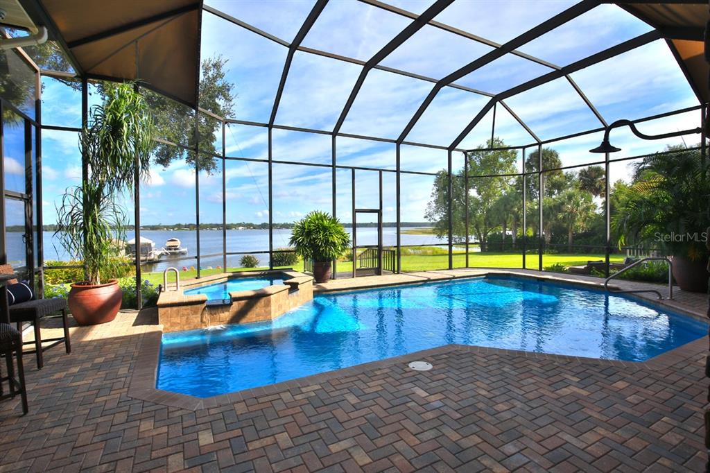 11035 Southeast Sunset Harbor Road Summerfield, FL 34491 - Photo 74 of 97 a view of swimming pool with seating area