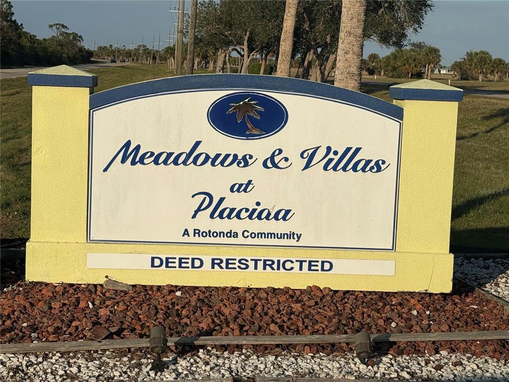 13 Laurel Court Placida, FL 33946 - Photo 12 of 12 a sign that is on the wall of a building