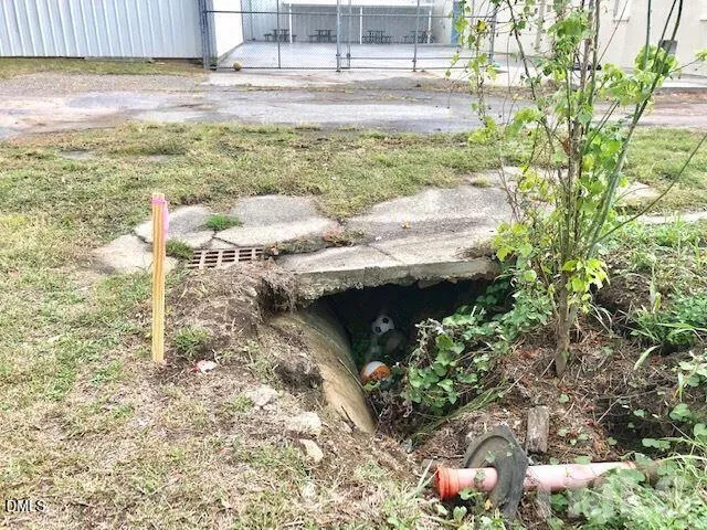 a view of a yard with an outdoor space