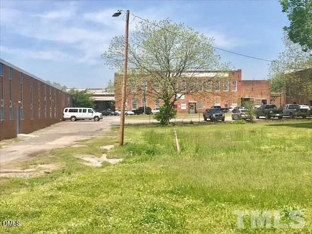 a swimming pool with outdoor seating and yard