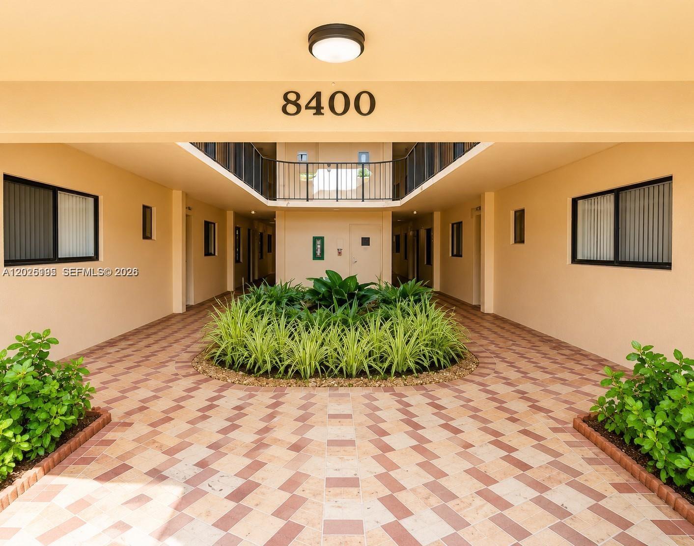8400 Southwest 133rd Avenue Road, Unit 121 Miami, FL 33183 - Photo 1 of 43 a front view of a house with garden
