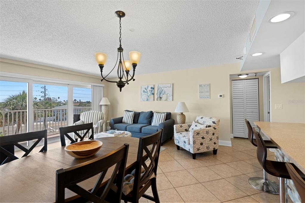 13440 Gulf Lane, Unit 202 Madeira Beach, FL 33708 - Photo 11 of 41 a living room with furniture and a large window