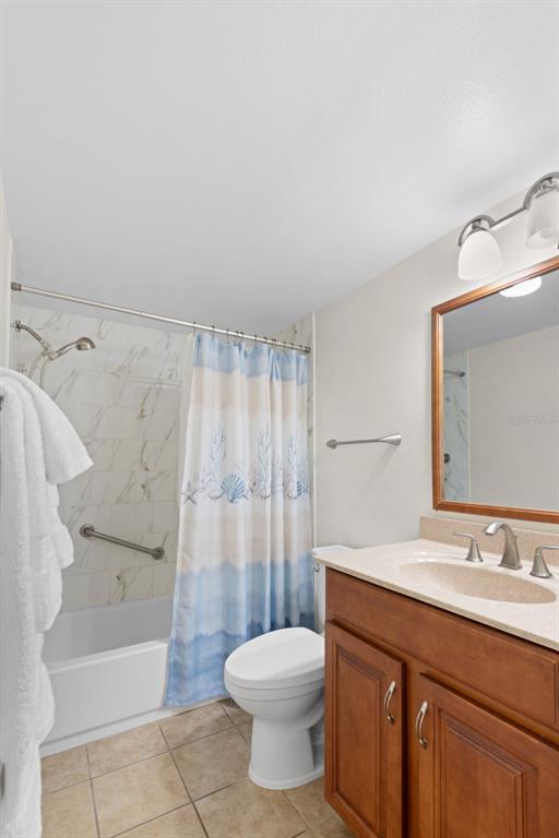 13440 Gulf Lane, Unit 202 Madeira Beach, FL 33708 - Photo 16 of 41 a bathroom with a sink toilet and shower