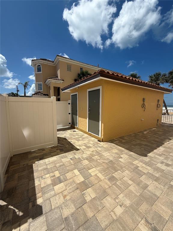 13440 Gulf Lane, Unit 202 Madeira Beach, FL 33708 - Photo 31 of 41 a view of a house with a backyard