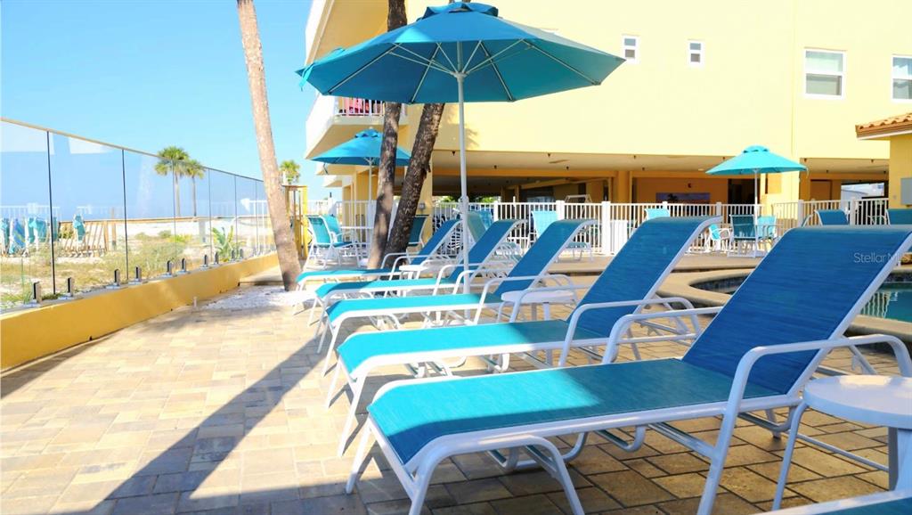 13440 Gulf Lane, Unit 202 Madeira Beach, FL 33708 - Photo 34 of 41 a view of a patio with swimming pool