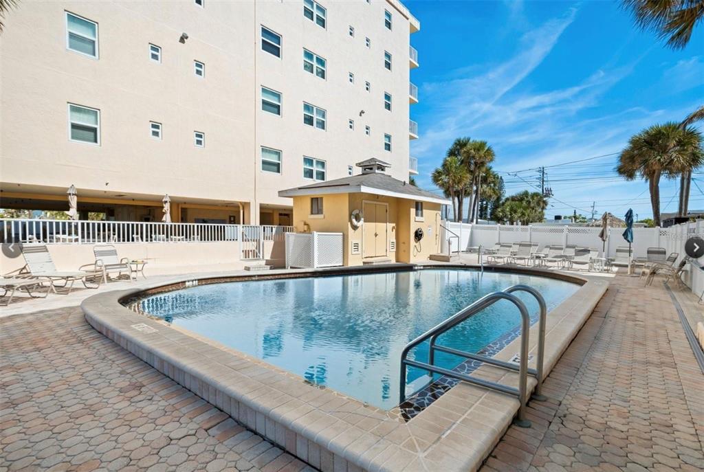 13440 Gulf Lane, Unit 202 Madeira Beach, FL 33708 - Photo 37 of 41 a view of swimming pool with outdoor seating