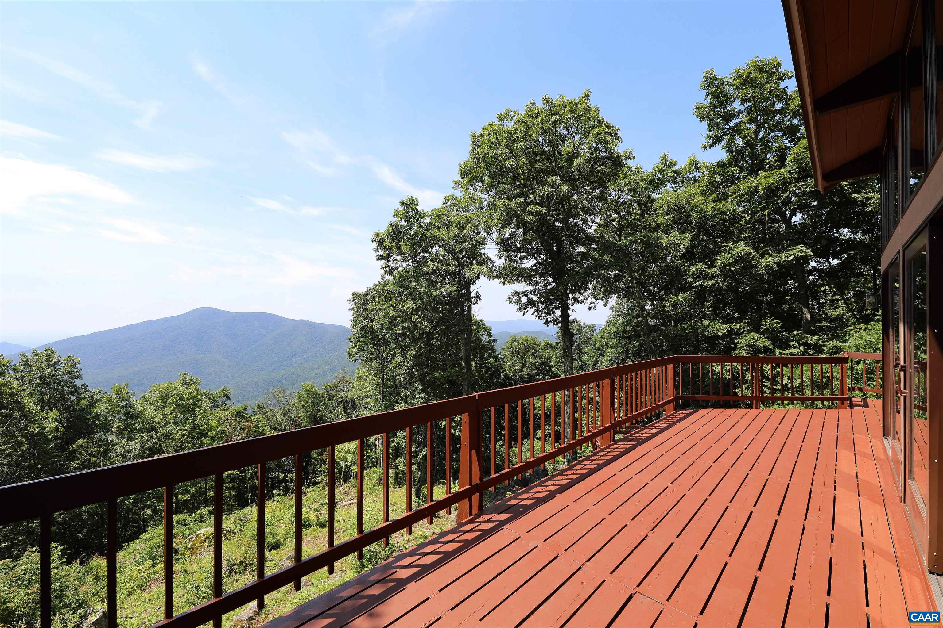 383 Cedar Drive Wintergreen, VA 22967 - Photo 1 of 47 a view of balcony with wooden floor and fence