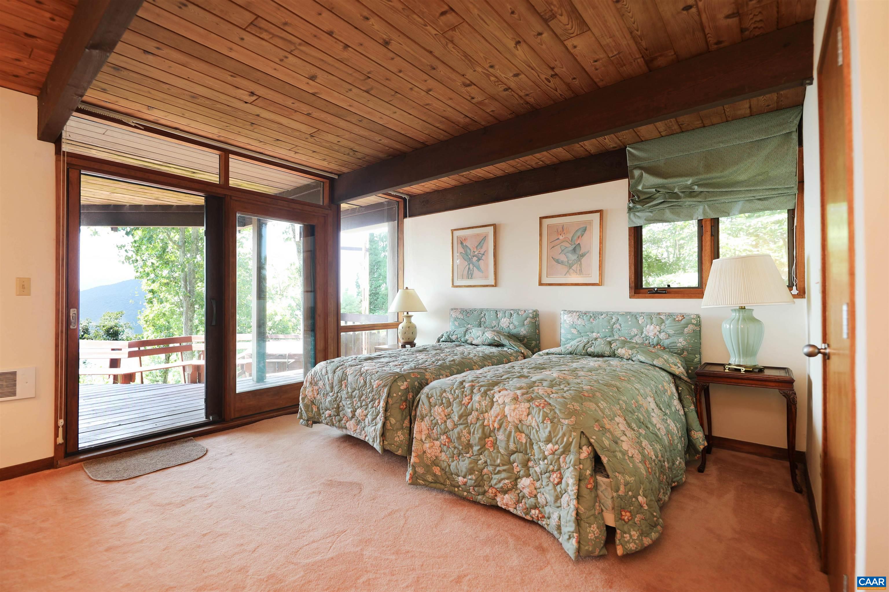 383 Cedar Drive Wintergreen, VA 22967 - Photo 28 of 47 a bed sitting in a spacious bedroom next to a window